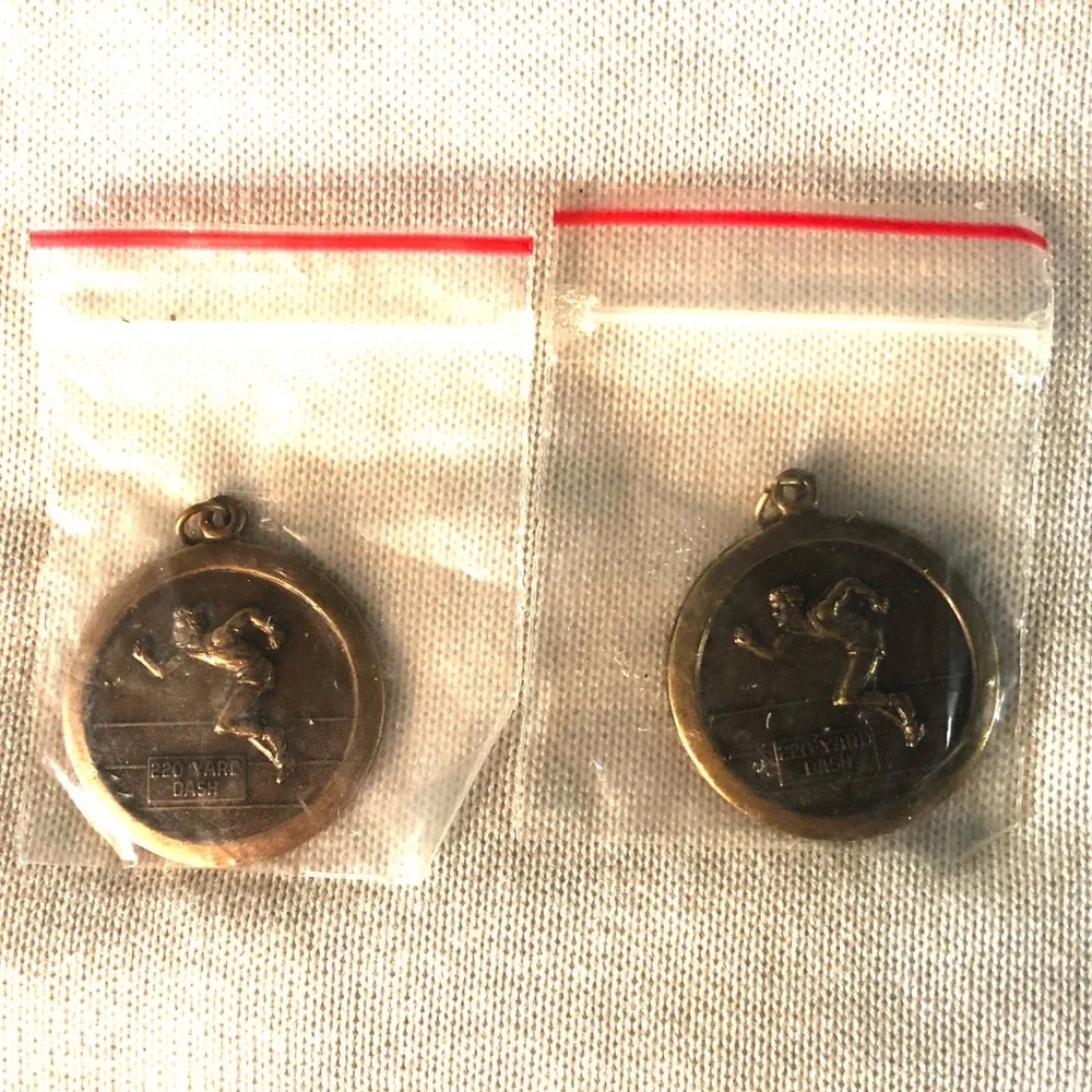 TWO 220 YARD DASH RUN PENDANTS BRONZE & BRASS TONE